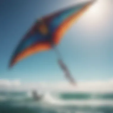 A vibrant kite soaring in the blue sky above the ocean