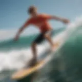 A beginner surfer balancing on a longboard in the ocean