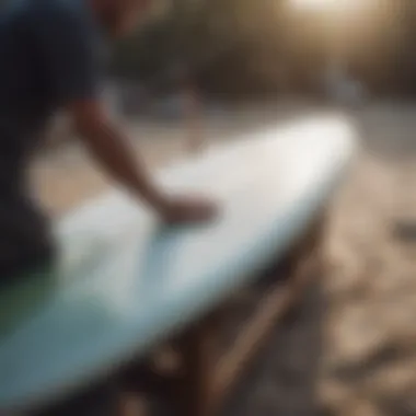 A surfboard being repaired with resin and fiberglass cloth