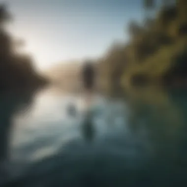 Person standing on paddle board in calm water