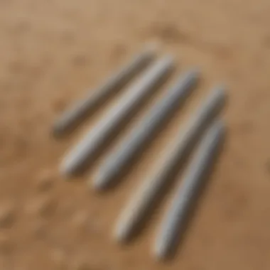 Eco-Friendly Surf Zinc Sticks on Beach An array of eco-friendly surf zinc sticks displayed on a sandy beach