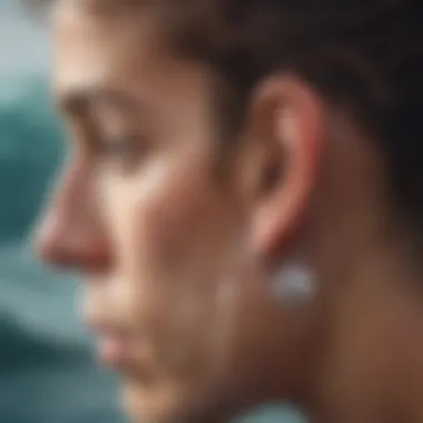 Illustration of Water Accumulation in the Ear An ear with water droplets illustrating the problem of trapped moisture