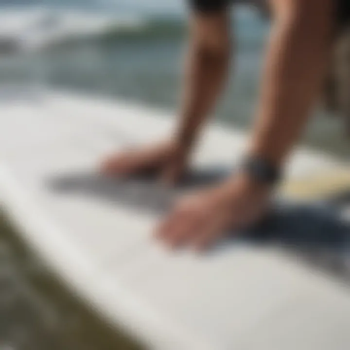 Installing Dakine Contour footstraps on a surfboard, highlighting installation techniques.