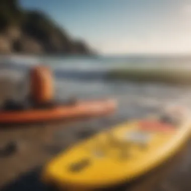 Safety equipment for paddle boarders laid out on a beach