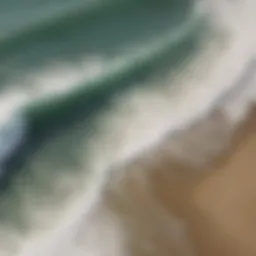 Aerial view of surfers riding waves at Malibu Beach