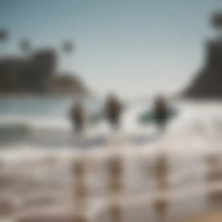 A group of surfers preparing to catch waves at Santa Monica Beach