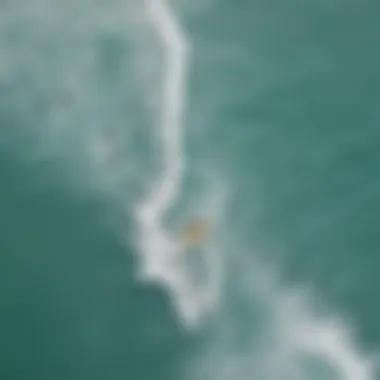 Aerial view of surfers catching waves in Aruba