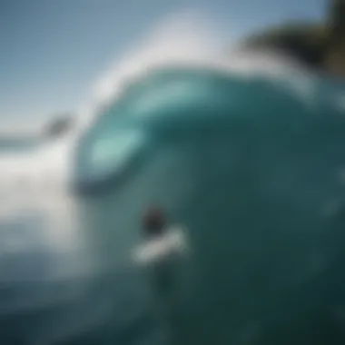 Aerial view of a surfer catching a wave at Uluwatu