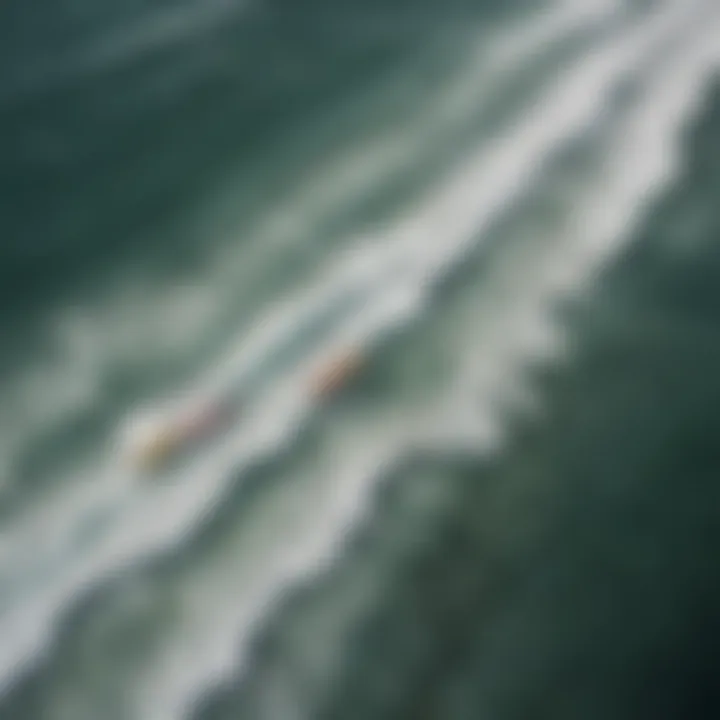 An aerial view of a picturesque coastline with motor surfboards gliding over the waves