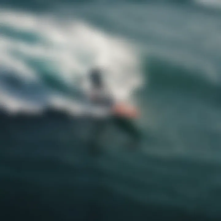 An aerial view showcasing a hydro foil surfer riding waves