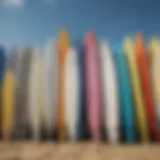 A collection of vibrant second hand surfboards lined up on the beach