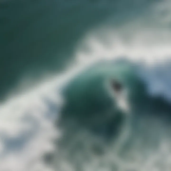 Surfer catching a wave captured from above