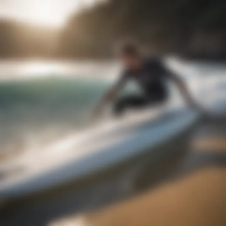 Surfer maintaining a Buell soft top surfboard