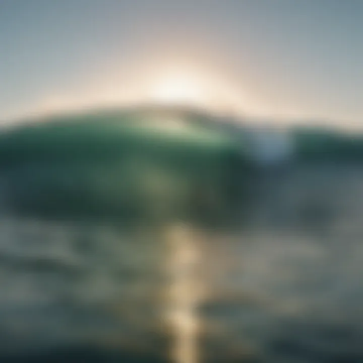 An aerial view of a surfer catching a wave at sunrise