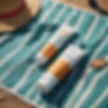 Close-up of eco-friendly sunscreen products on a beach towel