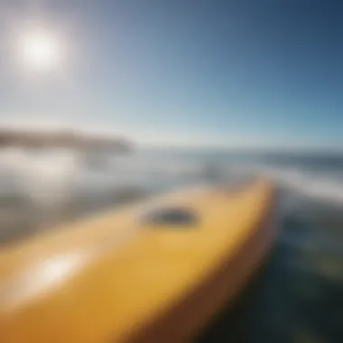 Scenic view of a surfboard and ocean, emphasizing the importance of sun protection