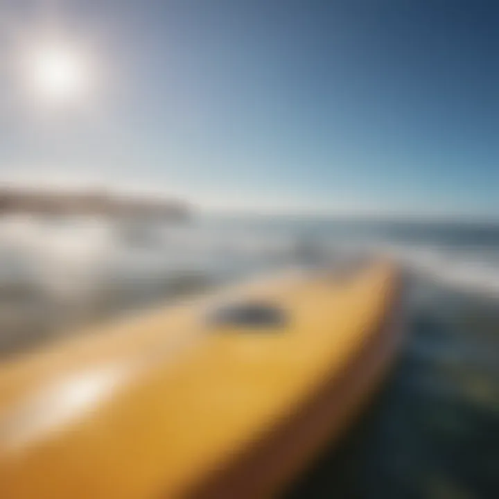 Scenic view of a surfboard and ocean, emphasizing the importance of sun protection