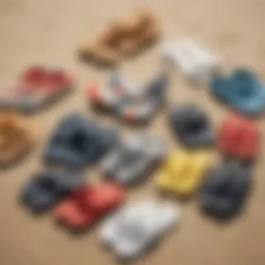 Diverse range of surfer slippers displayed on a sandy beach.