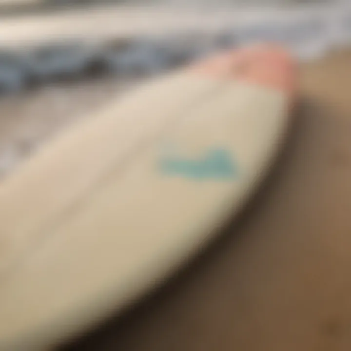 Close-up of surfboard on the sand, ready for action