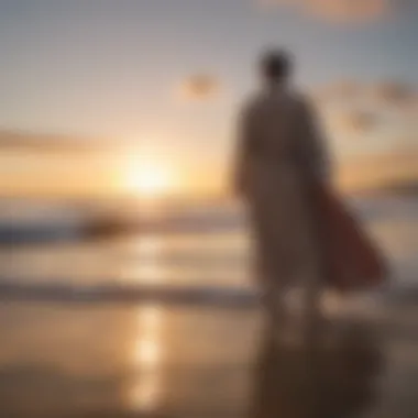 An artistic perspective of a towelling robe draped on a surfboard against a sunset