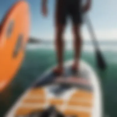 Close-up of high-quality paddleboarding equipment arranged neatly.