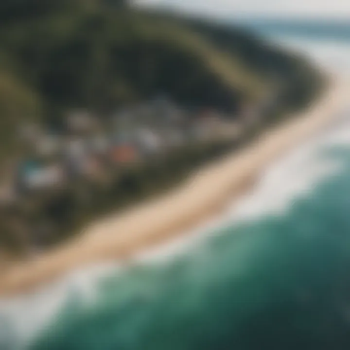 An aerial view of a sustainable surf camp along a pristine coastline