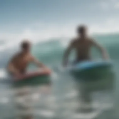 Two boogie boarders working together to navigate the waves