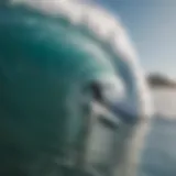 Surfer navigating large waves