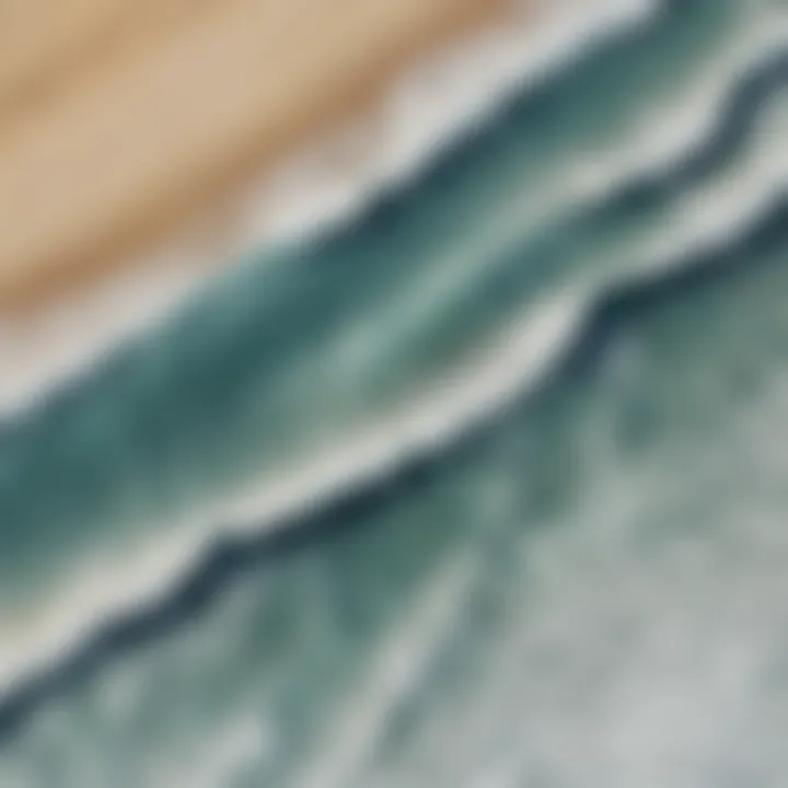 An aerial view of a beach with varying wave heights